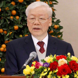 Old man holds podium to deliver New Year wish, Vietnam’s image of “loss”